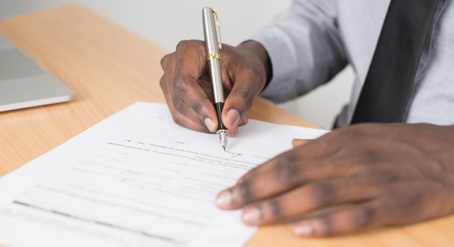 A man filling out a form