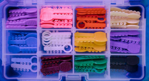 A close up box of various o-rings of different colors