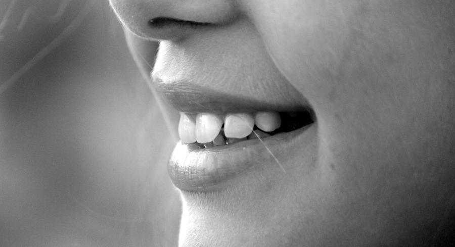 A close up image of a child smile with a clear view of their teeth