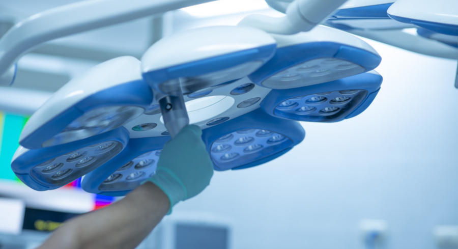 Surgical lamp being adjusted for surgery